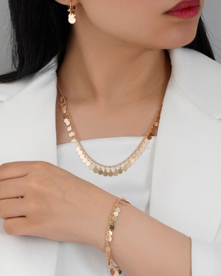 ست گردنبند و گوشواره و دستبند زنانه مدل شیک طلایی برند YSX با شرابه های پولکی آینه ای و گوشواره های حلقه ای در نوروژ