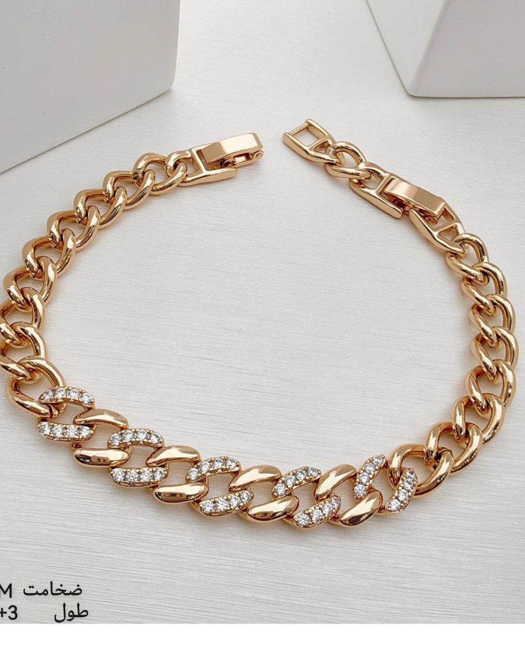 دستبندزنانه طلایی طرح کارتیه با نگین های سواروسکی ژوپینگ در نوروژ اکسسوری